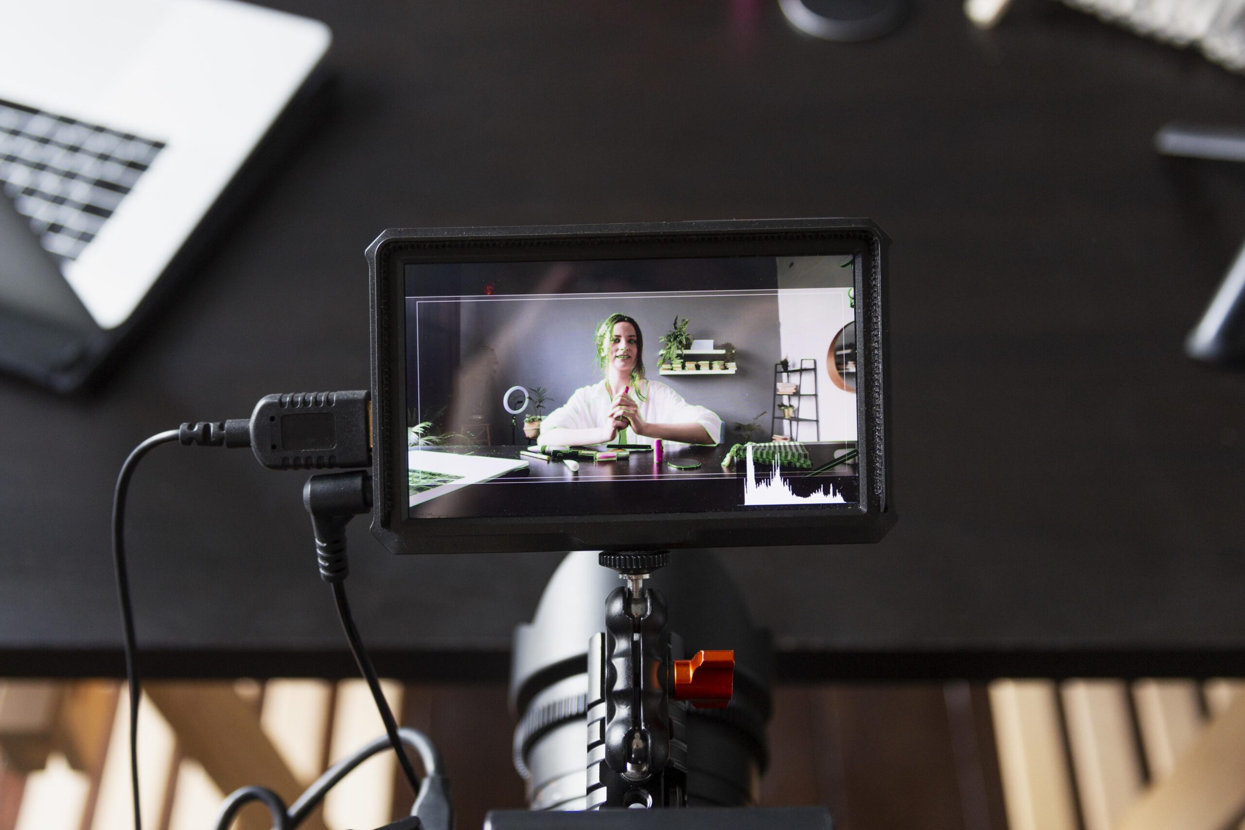 Entrepreneur recording a video for their personal brand using a smartphone and ring light.